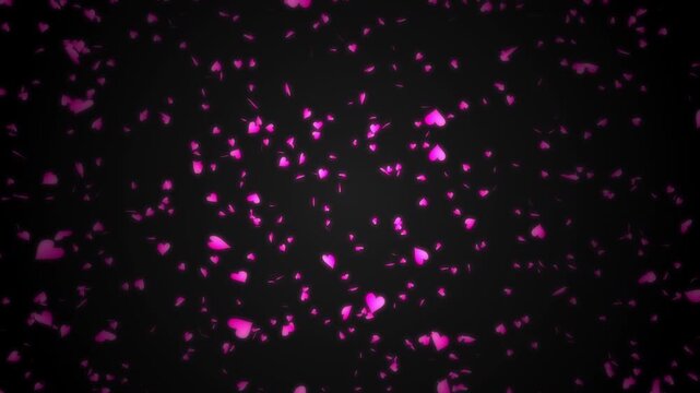 Pink heart shapes being lit up and falling down on black background. Abstract background for Happy Valentine's day and wedding ceremony.