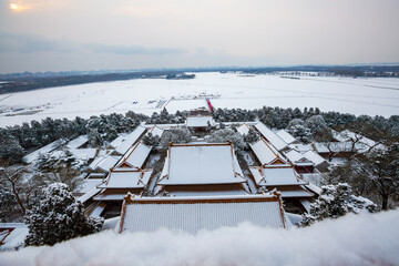 Tower of Buddhist Incense ancient architectural complex snowscape at the Summer Palace, Beijing, China