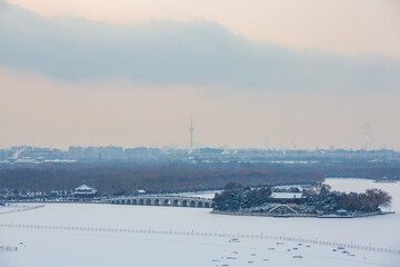 Kunming Lake ancient architectural complex snowscape at the Summer Palace, Beijing, China