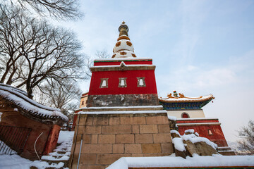 Four Great Regions ancient architecture after snow at the Summer Palace, Beijing, China