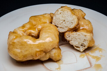 Campanian Christmas zeppole with honey are a typical treat from Campania during the holidays. They're made from a fried, leavened dough, then generously coated in warm honey.