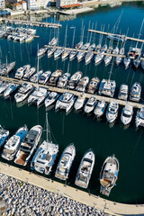 Fototapeta premium Yachts moored to the pier in the marina. Aerial view