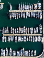 Fototapeta premium Yachts moored to the pier in the marina. Aerial view
