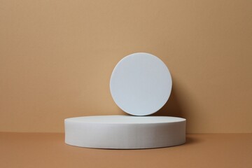 White podiums with smooth, textured surface under soft tones. Ideal for product mockups, cosmetic displays, or minimal brand presentations. 3D rendering