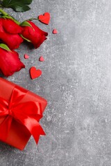 A vibrant Valentine's scene with gift box, roses and heart, for celebration and greeting ideas