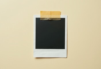 Blank Polaroid Photo with Tape on Beige Background