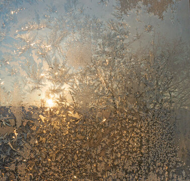 A window with frost patterns on the glass