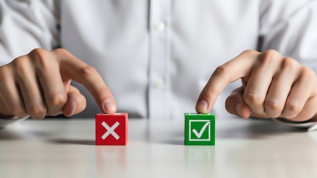 Businessman making a critical choice between two colored wooden blocks representing right versus wrong decisions or yes and no options
