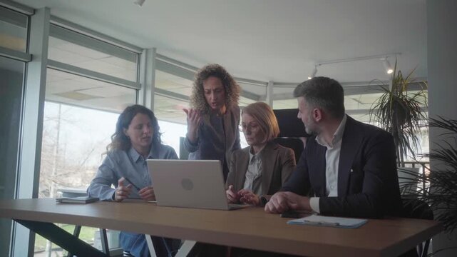 Angry female executive scolding team for mistakes and poor work quality in a modern office, highlighting negative business outcomes and professional tension.