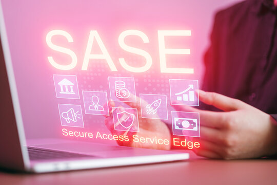 Working on secure access service edge concepts with a laptop and digital interface in a modern office setting