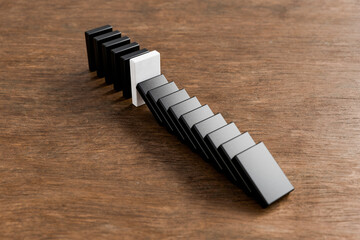 Black and White Domino Tiles on Wooden Table