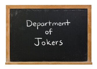 Obraz premium Department of jokers handwritten in white chalk on a black chalkboard in a wooden frame isolated on white.