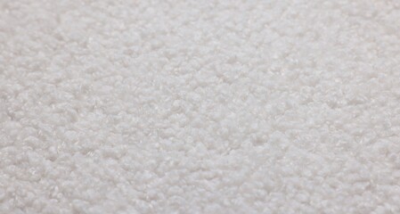 Texture of white wool fabric as background, closeup