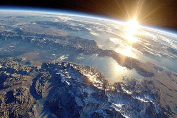 Earth from space with sunlight casting over mountains and water at dawn. The view captures the edge of the planet