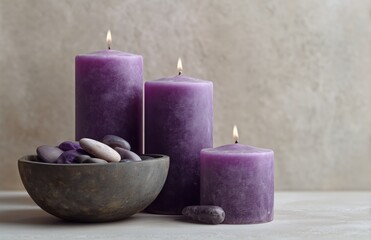 Purple candles and spa stones still life for relaxation