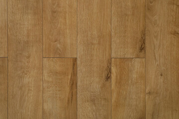Fototapeta premium Wooden floor covering in light brown tones seen from above during daytime