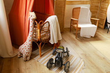 Childrens play area with toys and furniture in a cozy room setting for kids in the afternoon