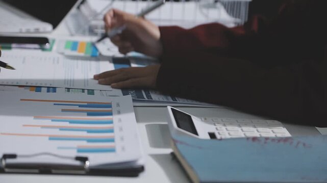 Asian male financial officer or accountant checking investment results Financial budget analysis Planning to summarize results and report to the meeting Audit concept and investment results.