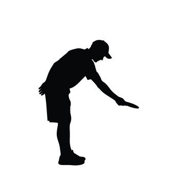 Black silhouette of man bending over wearing shorts and baseball cap