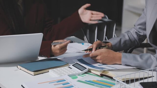Asian male financial officer or accountant checking investment results Financial budget analysis Planning to summarize results and report to the meeting Audit concept and investment results.