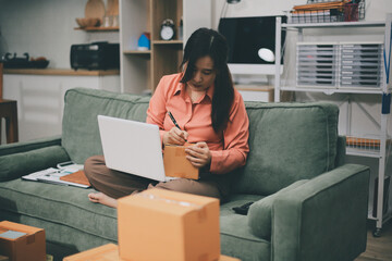 Startup, small business, SME owner check online orders. data logging Business growth, selling products, working with boxes. freelance work at home office online sme business small organization