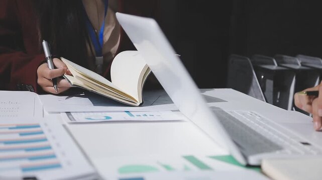 Asian male financial officer or accountant checking investment results Financial budget analysis Planning to summarize results and report to the meeting Audit concept and investment results.