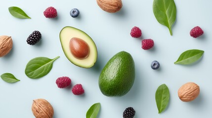 Flat lay of fertility support nutrition foods including avocado, nuts, berries, and spinach on a light blue background