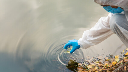 Take water samples for analysis. Selective focus.