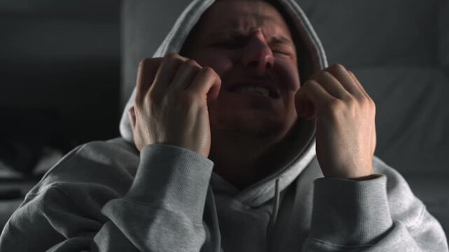 A man in a hood sits on the floor, suffering from a drug shortage.
Drug overdose and poor emotional state.
Stress and depression without drugs.