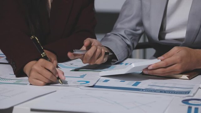 Asian male financial officer or accountant checking investment results Financial budget analysis Planning to summarize results and report to the meeting Audit concept and investment results.