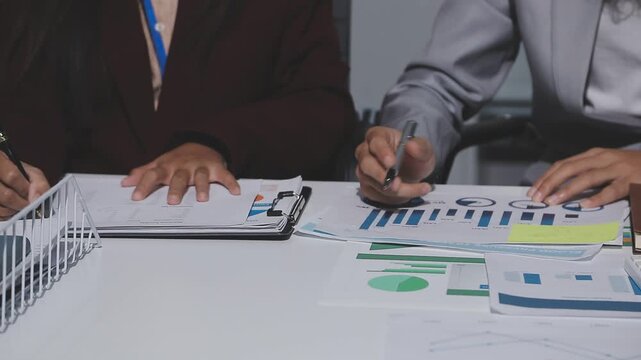 Asian male financial officer or accountant checking investment results Financial budget analysis Planning to summarize results and report to the meeting Audit concept and investment results.