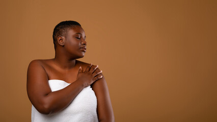 Bodycare Concept. Portrait Of Young Black Woman With Perfect Skin And Closed Eyes Hugging Herself ,...