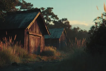 Poster de jardin  Rustic Charm: Old Wooden Cabins in a Tranquil Rural Landscape  © Image Tree