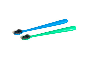 A two toothbrush on white background with copy space, close-up, top view. Dental oral hygiene concept