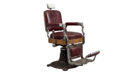 An antique red leather barber chair with intricate metalwork and a reclining backrest, perfect for retro salon or grooming visuals.