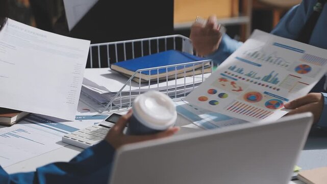 Asian male financial officer or accountant checking investment results Financial budget analysis Planning to summarize results and report to the meeting Audit concept and investment results.