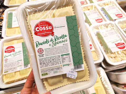 Cagliari, Italy - January 14, 2026: Packaged ravioli di ricotta e spinaci by Antonio Cossu displayed in a grocery store among other pasta products in a fresh food section