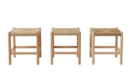 A set of three identical rustic-style bar stools featuring woven seats and natural wooden frames. Isolated on a transparent background.