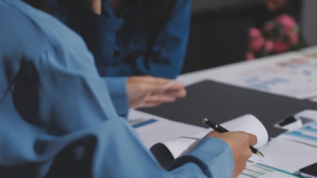 Asian male financial officer or accountant checking investment results Financial budget analysis Planning to summarize results and report to the meeting Audit concept and investment results.