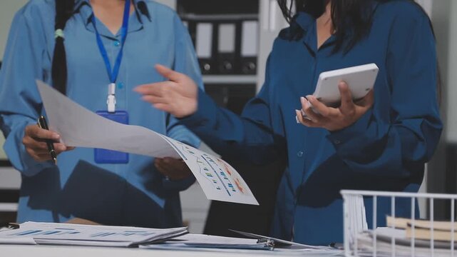 Asian male financial officer or accountant checking investment results Financial budget analysis Planning to summarize results and report to the meeting Audit concept and investment results.