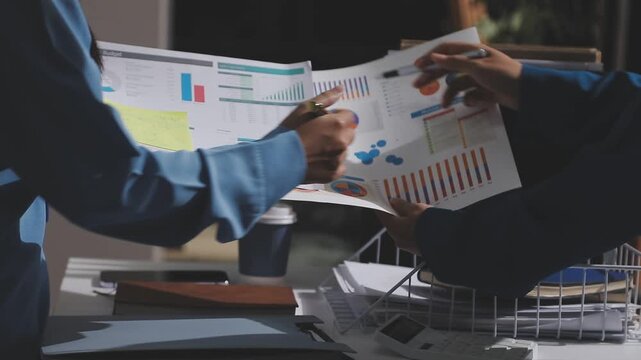 Asian male financial officer or accountant checking investment results Financial budget analysis Planning to summarize results and report to the meeting Audit concept and investment results.