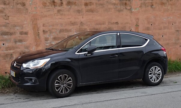 Citro&euml;n DS 4 car parked by old wall