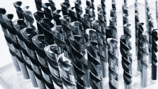 various types of drill bits milling cutter. display is organized and bits are arranged in way that makes it easy to see the differences between them