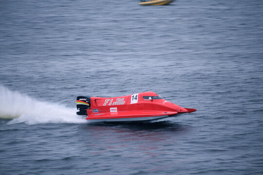 Vyshgorod, Ukraine - July 22, 2012. F1H2O powerboat gliding over waves and leaving a white spray trail during an exciting championship race
