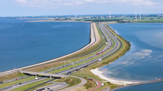 contemporary dark roofed museum pavilion integrated into green mantled historic fortifications pedestrian walkways define intricate layout afsluitdijk netherlands dark-roofed building 