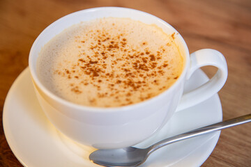 Obraz premium Traditional hot cocoa with spicy cinnamon seasoning. Close up