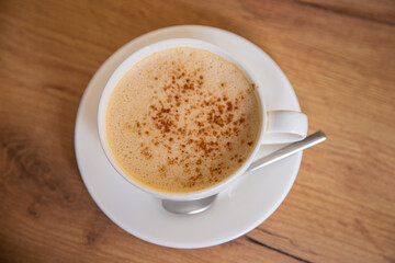 Traditional hot cocoa with spicy cinnamon seasoning. Close up