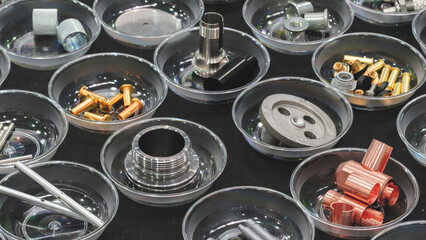 Various bolts, screws, nuts, bushings and other metal fasteners