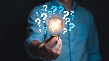 Glowing Lightbulb with Question Mark Icons Representing Problem Solving and Brainstorming Solutions