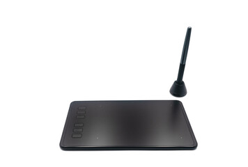 Black graphic tablet with stylus on white background